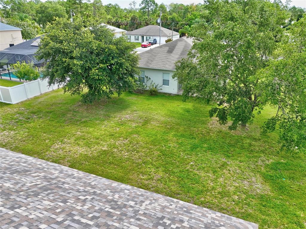 91 Sea Trail Palm Coast, FL 32164 - Photo 9 of 78 a view of a garden with a building in the background