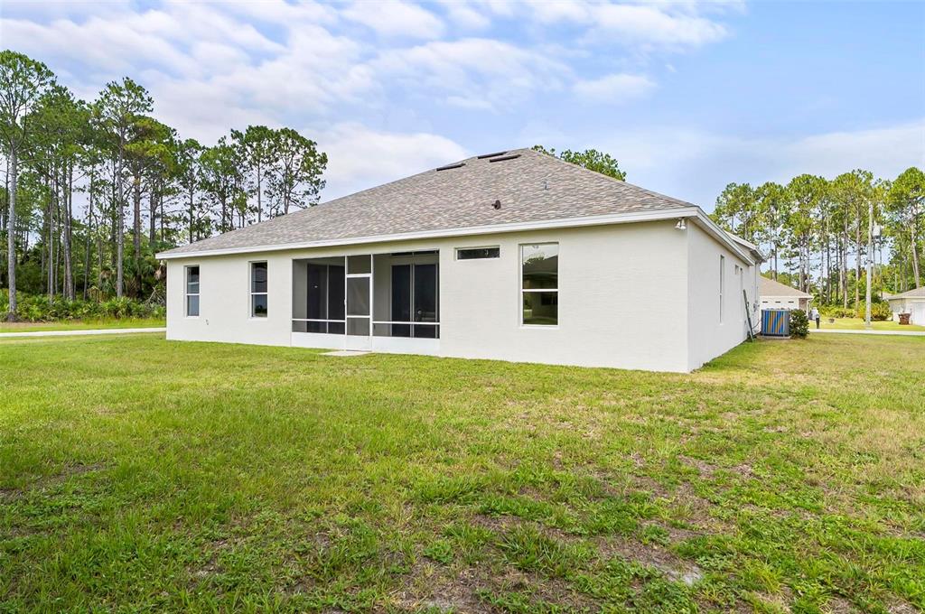 91 Sea Trail Palm Coast, FL 32164 - Photo 10 of 78 a view of a house with a backyard