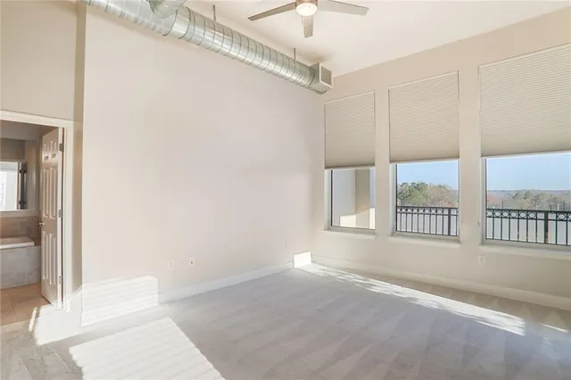 a view of an empty room and a window