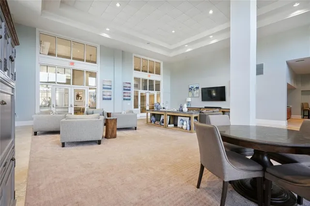 a living room with furniture and flat screen tv