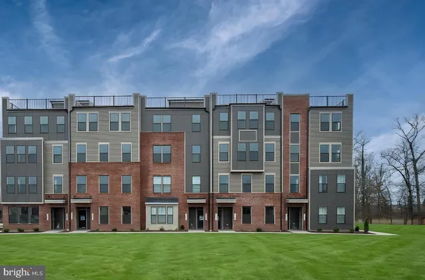 a view of a building with a yard