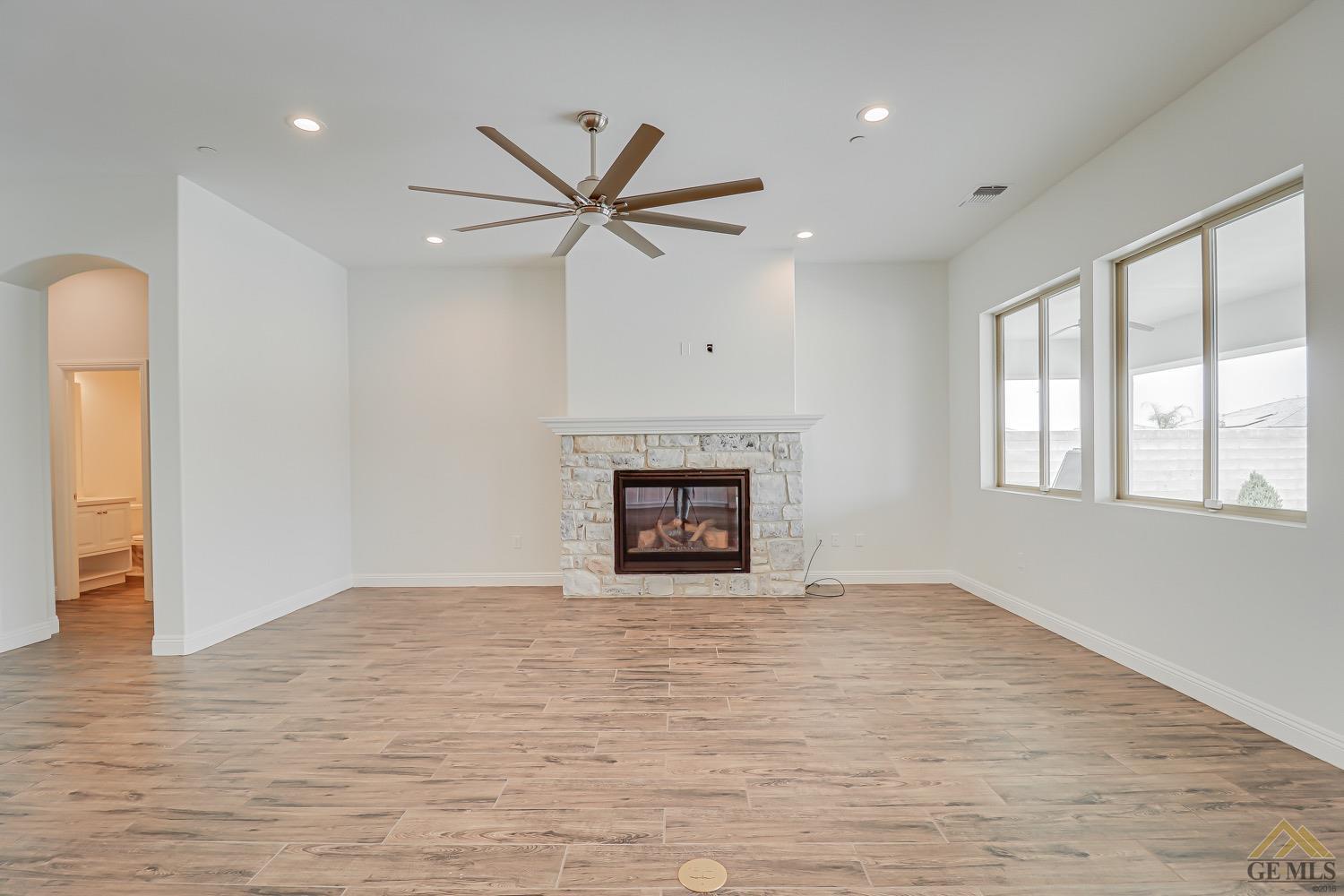 Undisclosed Address Bakersfield, CA 93311 - Photo 13 of 34 a view of an empty room with a window and fireplace