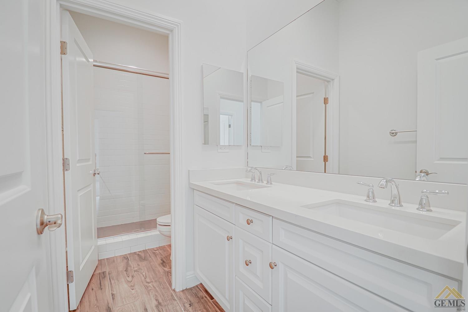 Undisclosed Address Bakersfield, CA 93311 - Photo 20 of 34 a bathroom with a double vanity sink mirror and double