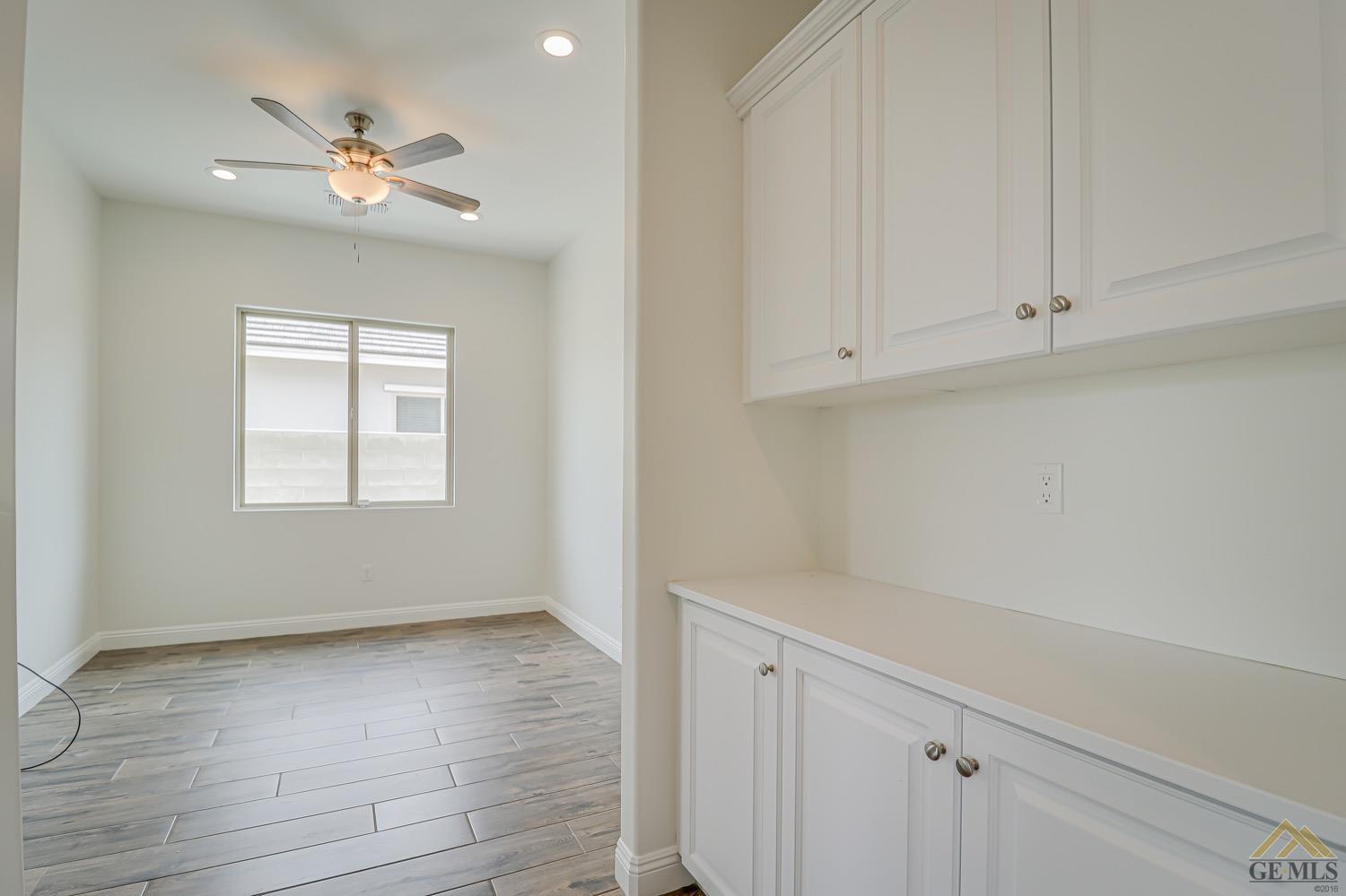 Undisclosed Address Bakersfield, CA 93311 - Photo 21 of 34 wooden floor in an empty room with a window