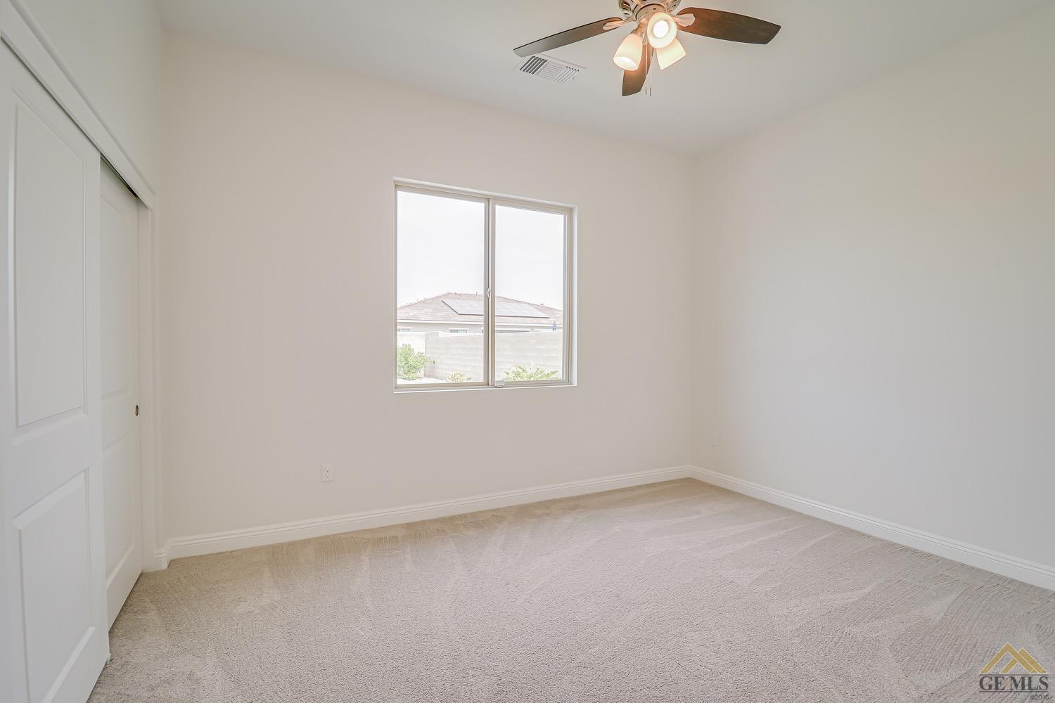 Undisclosed Address Bakersfield, CA 93311 - Photo 22 of 34 an empty room with a window