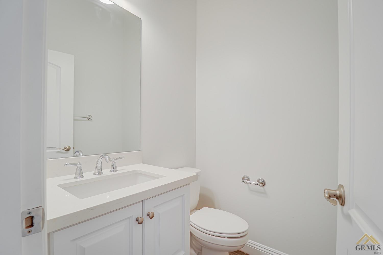 Undisclosed Address Bakersfield, CA 93311 - Photo 25 of 34 a bathroom with a sink toilet and vanity