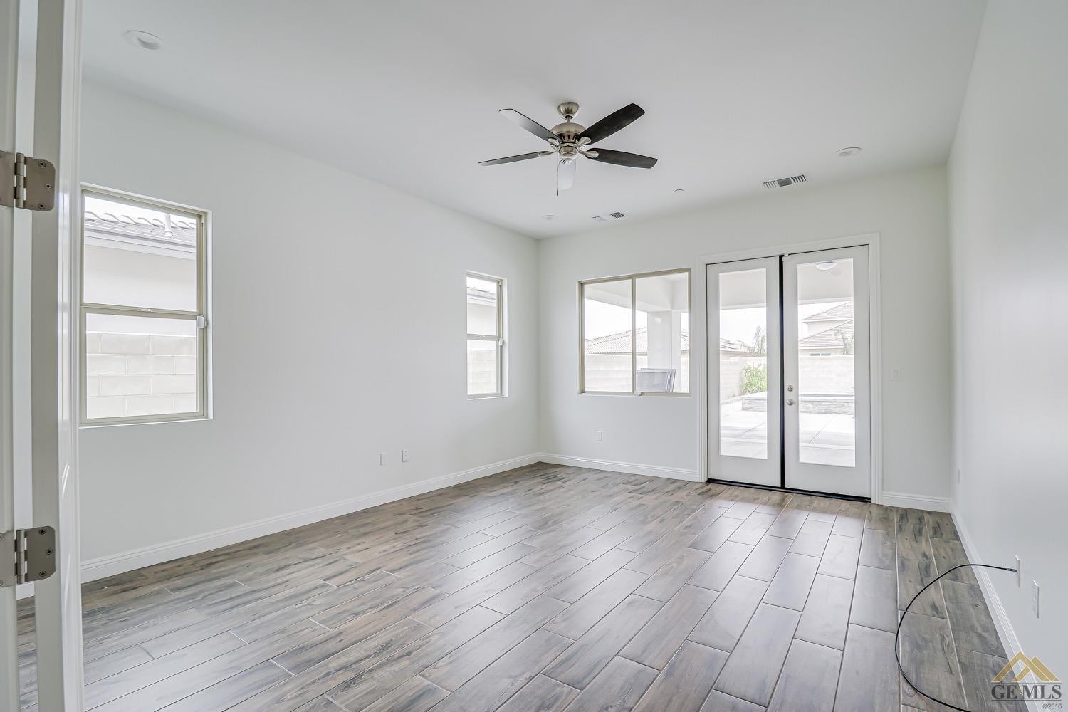 Undisclosed Address Bakersfield, CA 93311 - Photo 26 of 34 a view of an empty room with wooden floor and a window