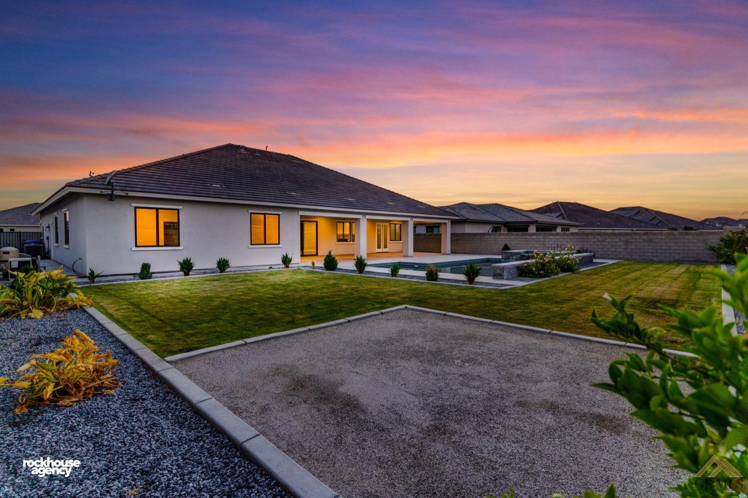 Undisclosed Address Bakersfield, CA 93311 - Photo 31 of 34 a front view of a house with a yard