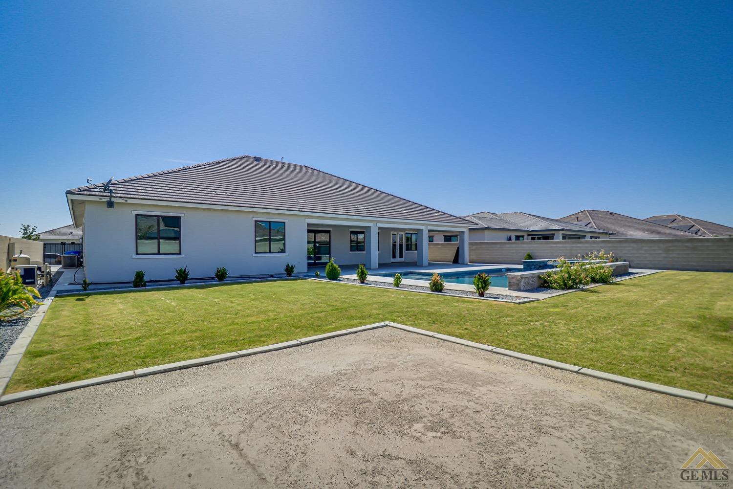 Undisclosed Address Bakersfield, CA 93311 - Photo 33 of 34 a front view of a house with a yard