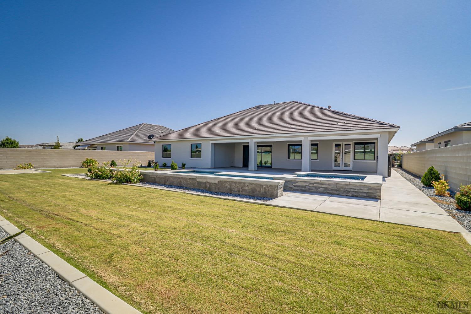 Undisclosed Address Bakersfield, CA 93311 - Photo 34 of 34 a house with swimming pool in front of it