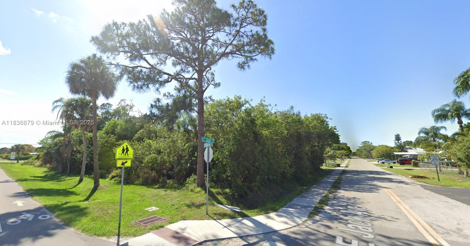 5120 Southeast Jack Avenue Stuart, FL 34997 - Photo 1 of 2 a view of a park with large trees