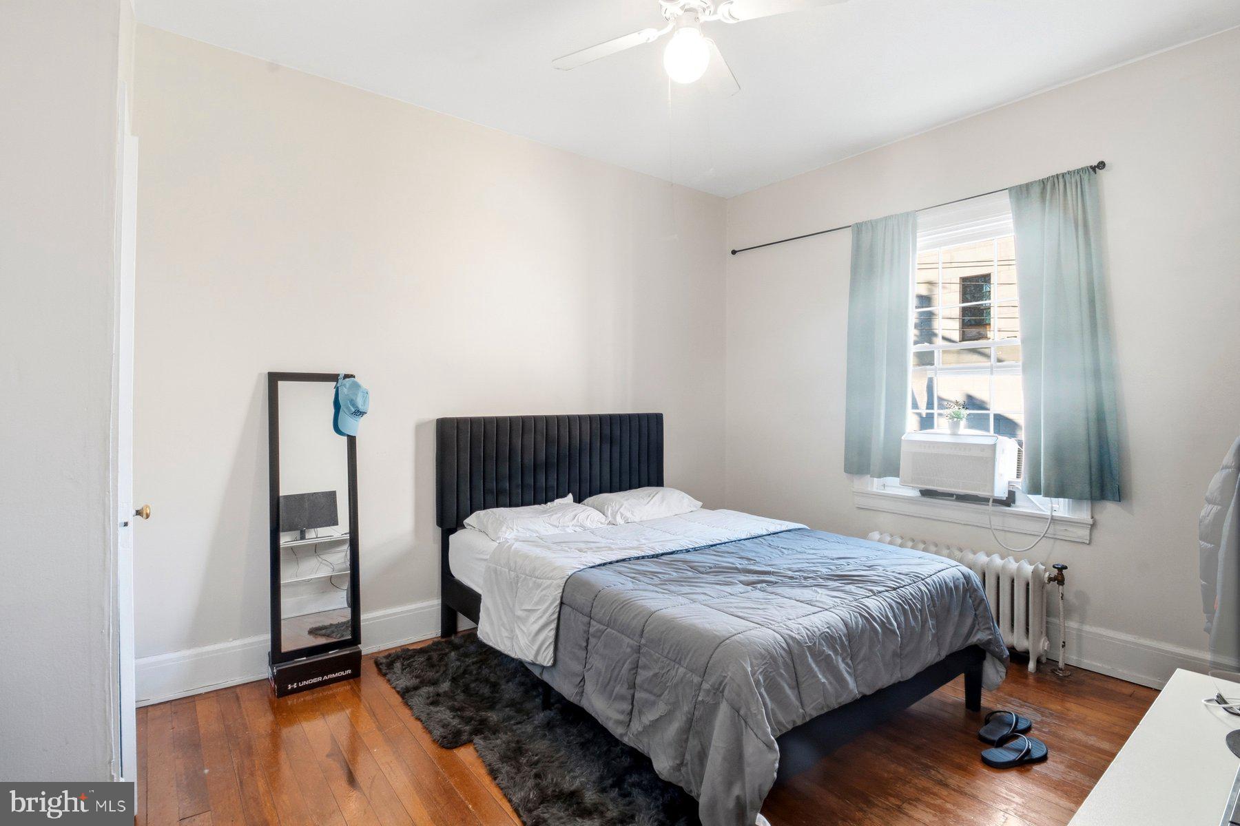101 West 39th Street, Unit C3 Baltimore, MD 21210 - Photo 20 of 28 a bedroom with a bed and a window