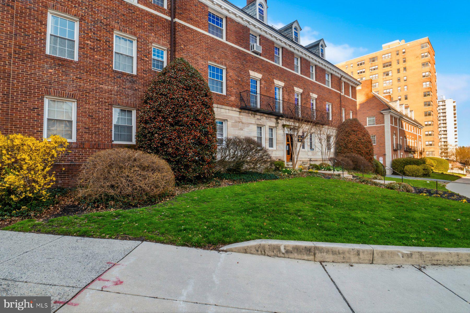 101 West 39th Street, Unit C3 Baltimore, MD 21210 - Photo 2 of 28 a view of a building next to a yard