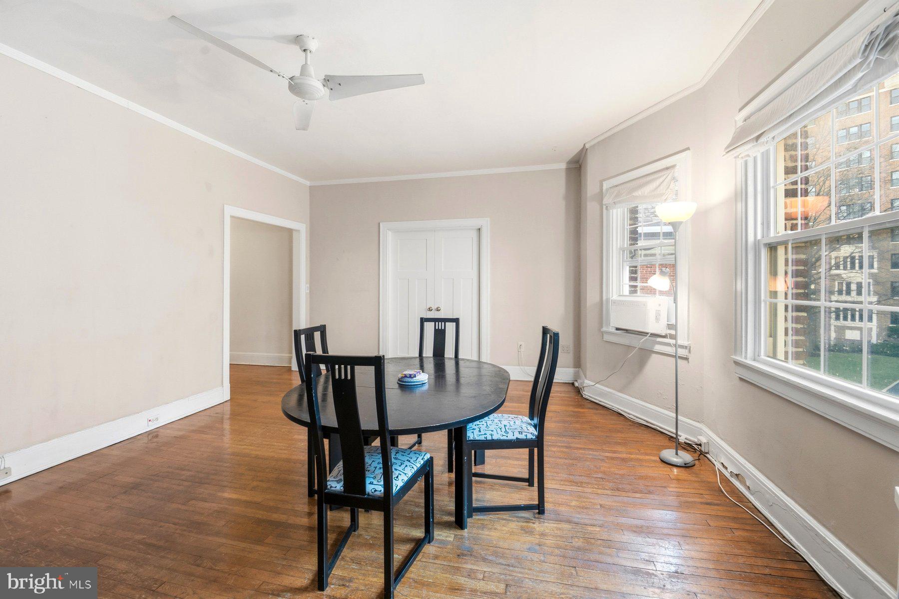 101 West 39th Street, Unit C3 Baltimore, MD 21210 - Photo 10 of 28 a view of a dining room with furniture and wooden floor