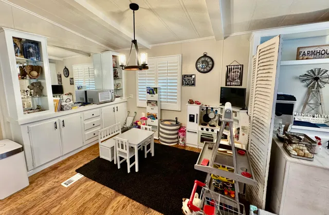 a very nice looking living room with furniture and a flat screen tv