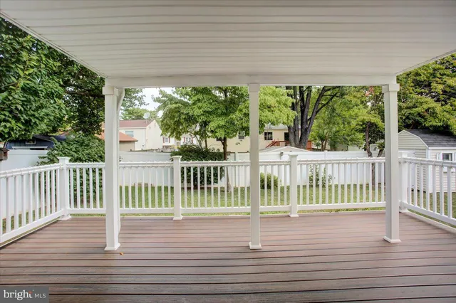 a view of a porch and wooden floor