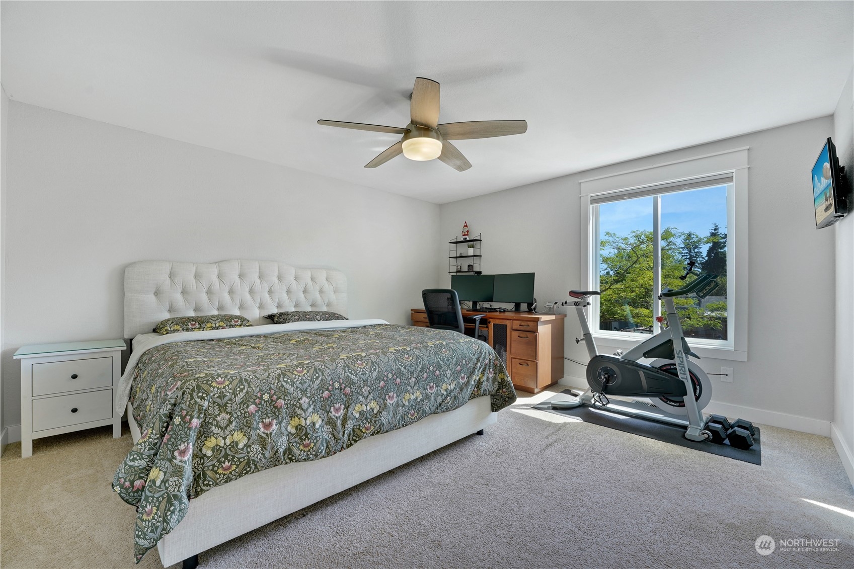 1410 220th Street Southwest Bothell, WA 98021 - Photo 17 of 25 a bedroom with a bed a chandelier and a window