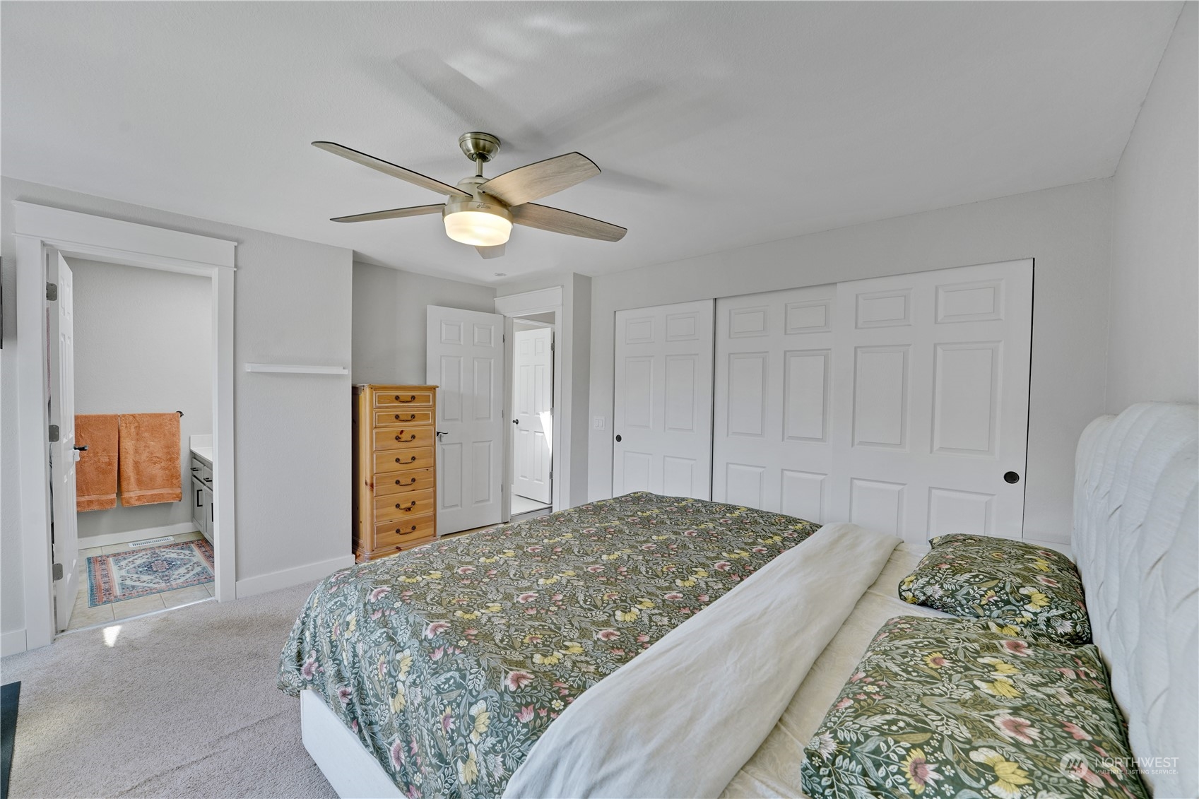 1410 220th Street Southwest Bothell, WA 98021 - Photo 18 of 25 a bedroom with a bed and a chandelier