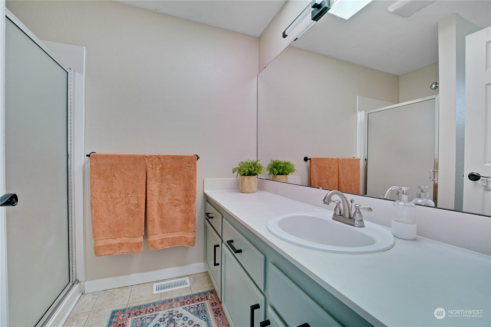 1410 220th Street Southwest Bothell, WA 98021 - Photo 19 of 25 a bathroom with a sink and a mirror