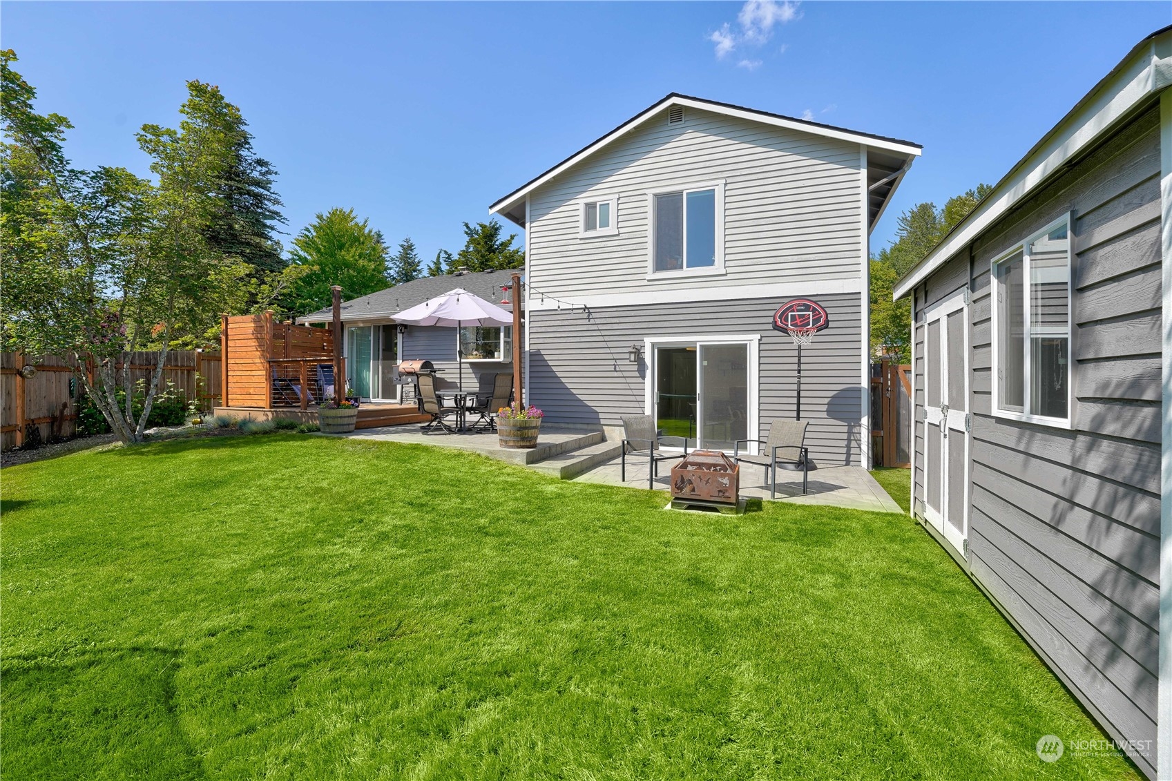 1410 220th Street Southwest Bothell, WA 98021 - Photo 4 of 25 a view of a house with a yard and chairs