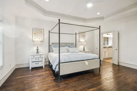 a bedroom with a bed and a table