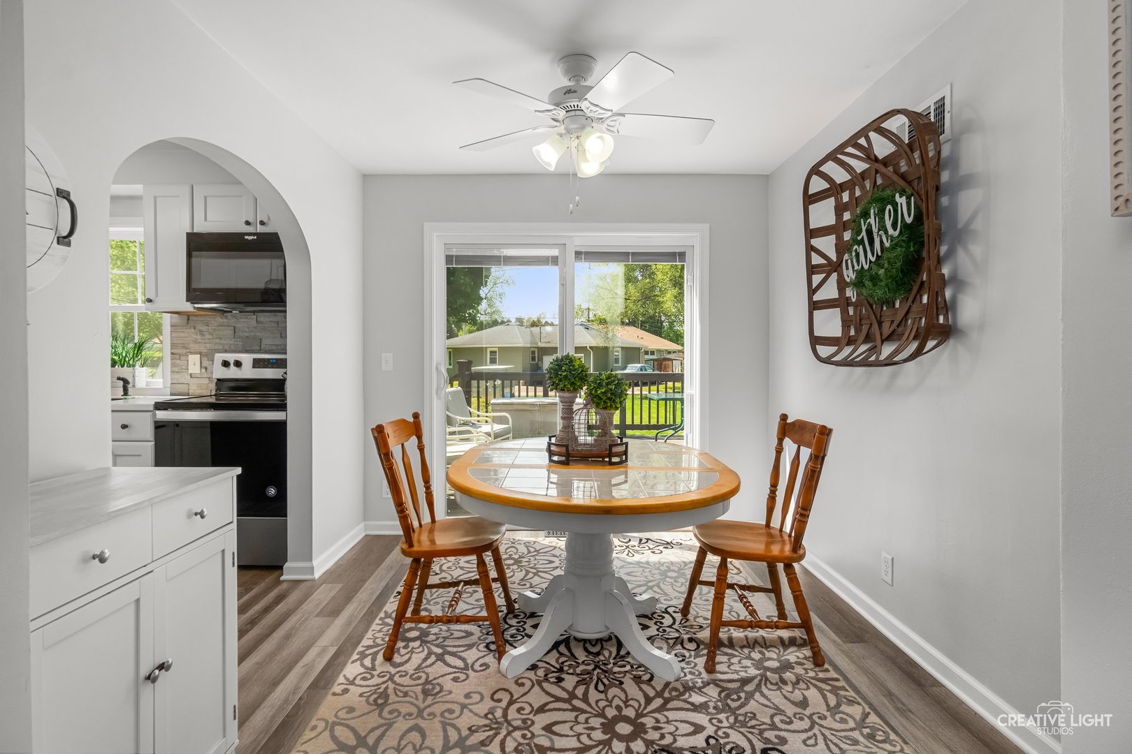 1606 Clark Street DeKalb, IL 60115 - Photo 4 of 20 a view of a dining room with furniture and a chandelier