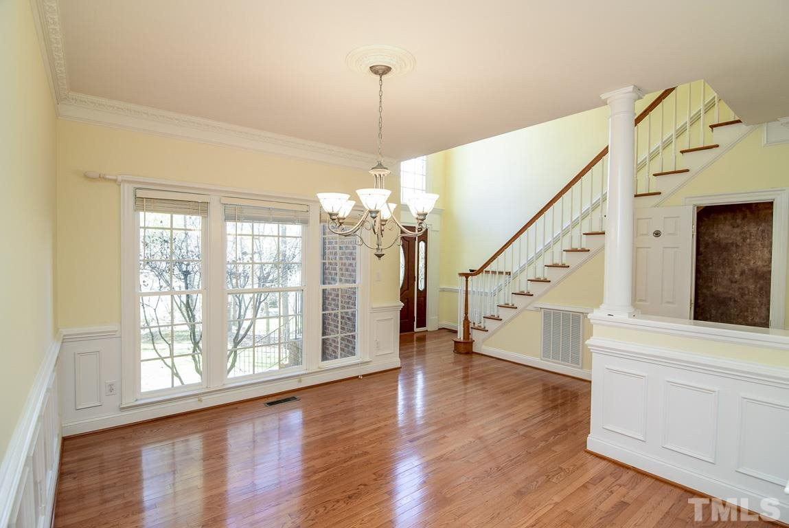 3813 April Place Raleigh, NC 27612 - Photo 2 of 25 Beautiful formal dining room with hardwoods. Although it is a separate area it is open and flows into the kitchen and family room. There is extensive gingerbread molding in this room. Dining Room