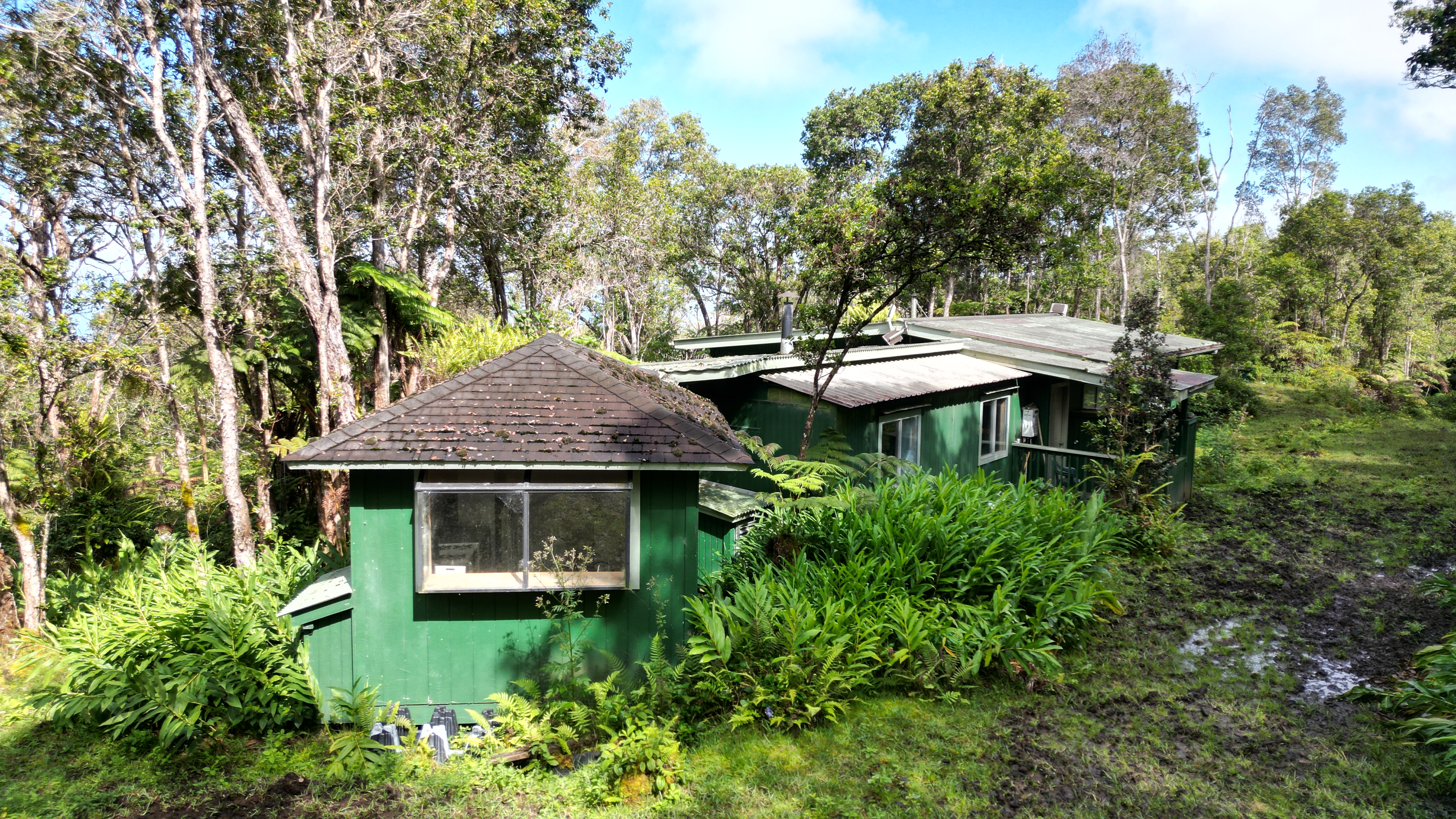 Mamalahoa Highway Captain Cook, HI 96704 - Photo 6 of 19 a front view of a house with a yard table and chairs