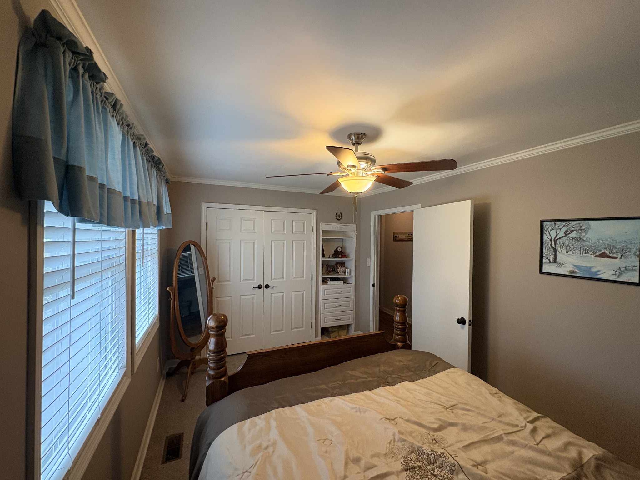 4454 Nancy Green Ridge Road Pulaski, TN 38478 - Photo 15 of 40 a bedroom with a bed and a chandelier