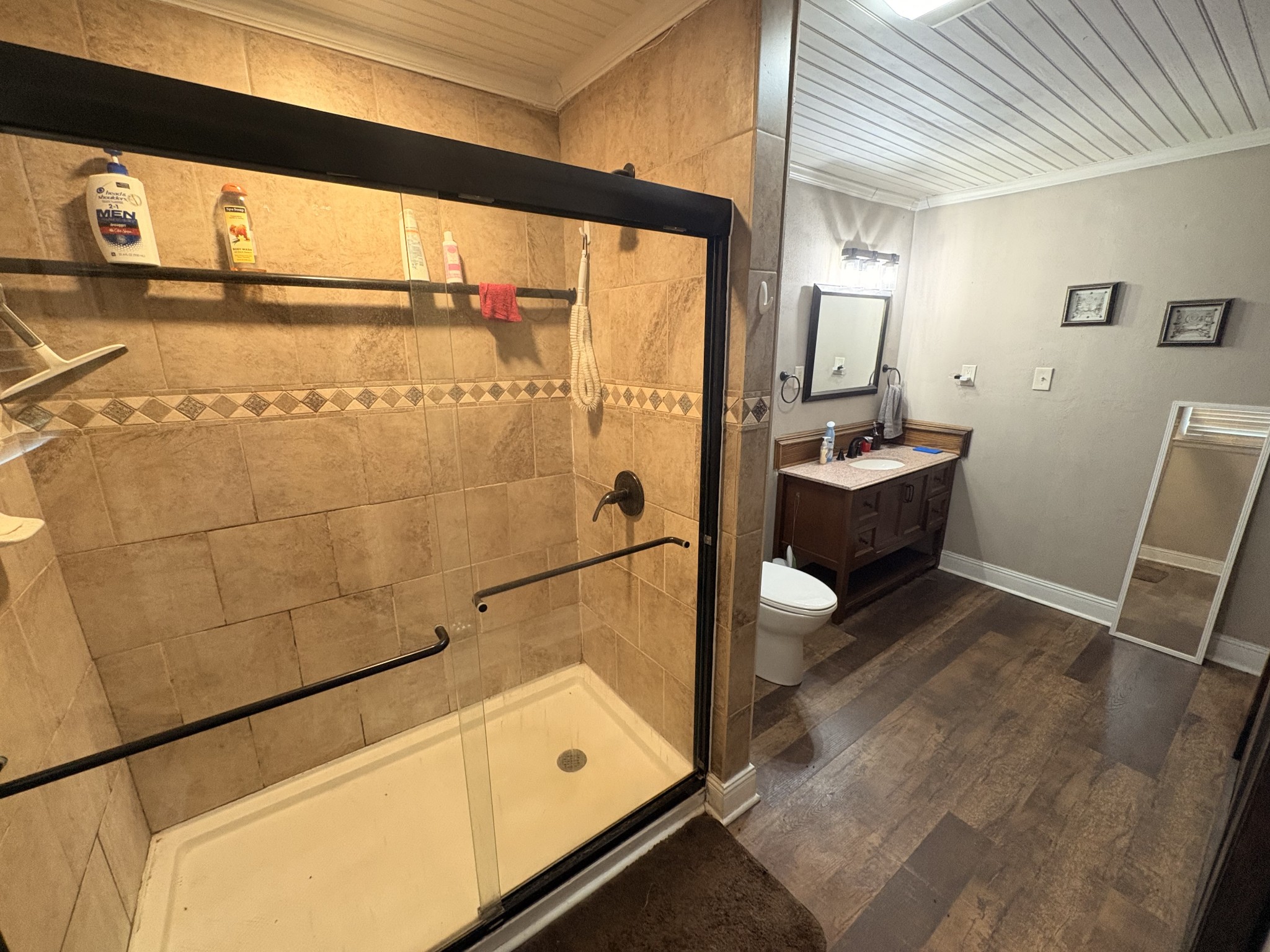 4454 Nancy Green Ridge Road Pulaski, TN 38478 - Photo 18 of 40 a bathroom with a granite countertop sink a toilet and bathtub