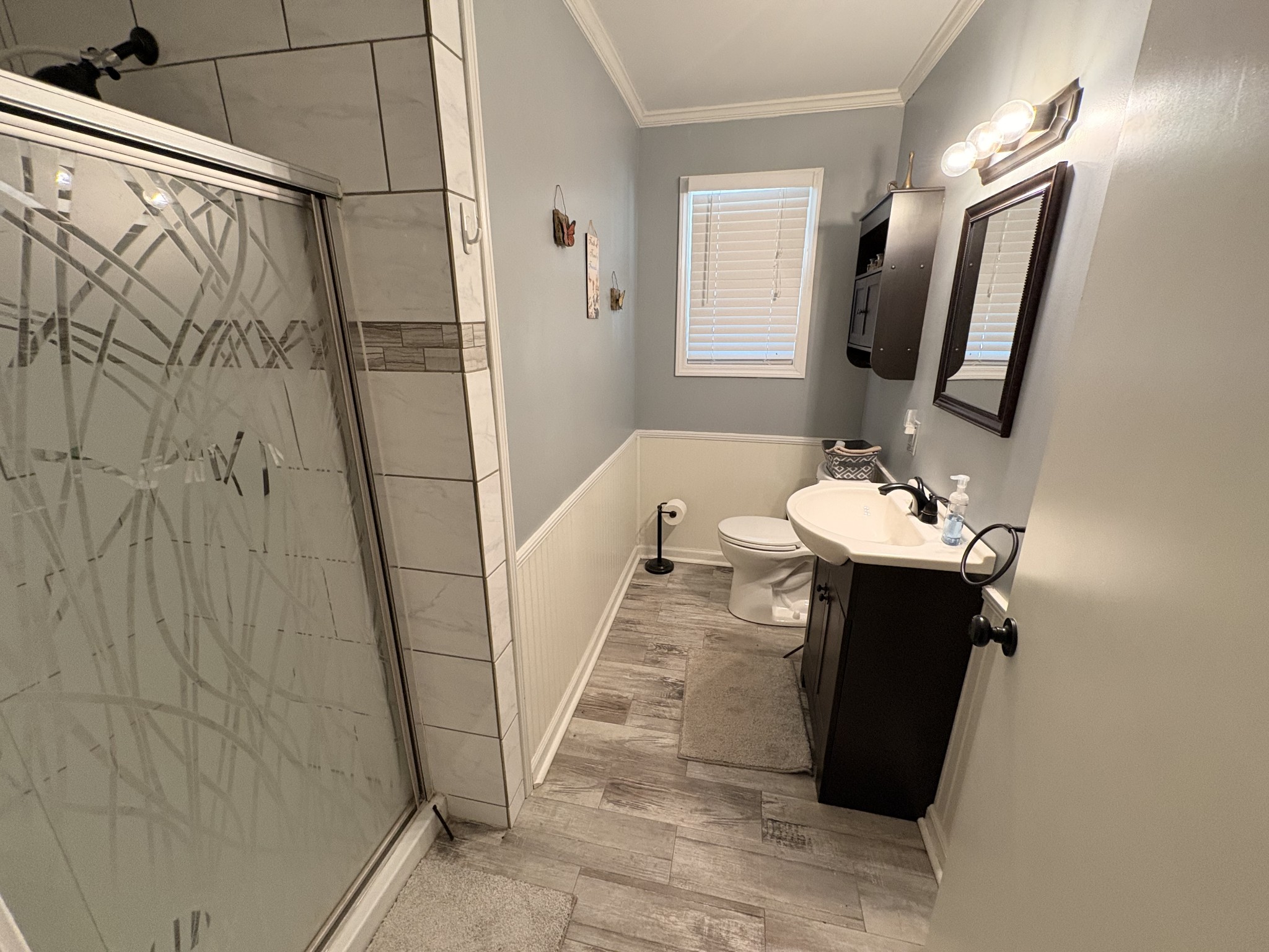4454 Nancy Green Ridge Road Pulaski, TN 38478 - Photo 23 of 40 a bathroom with a sink and mirror with bathtub