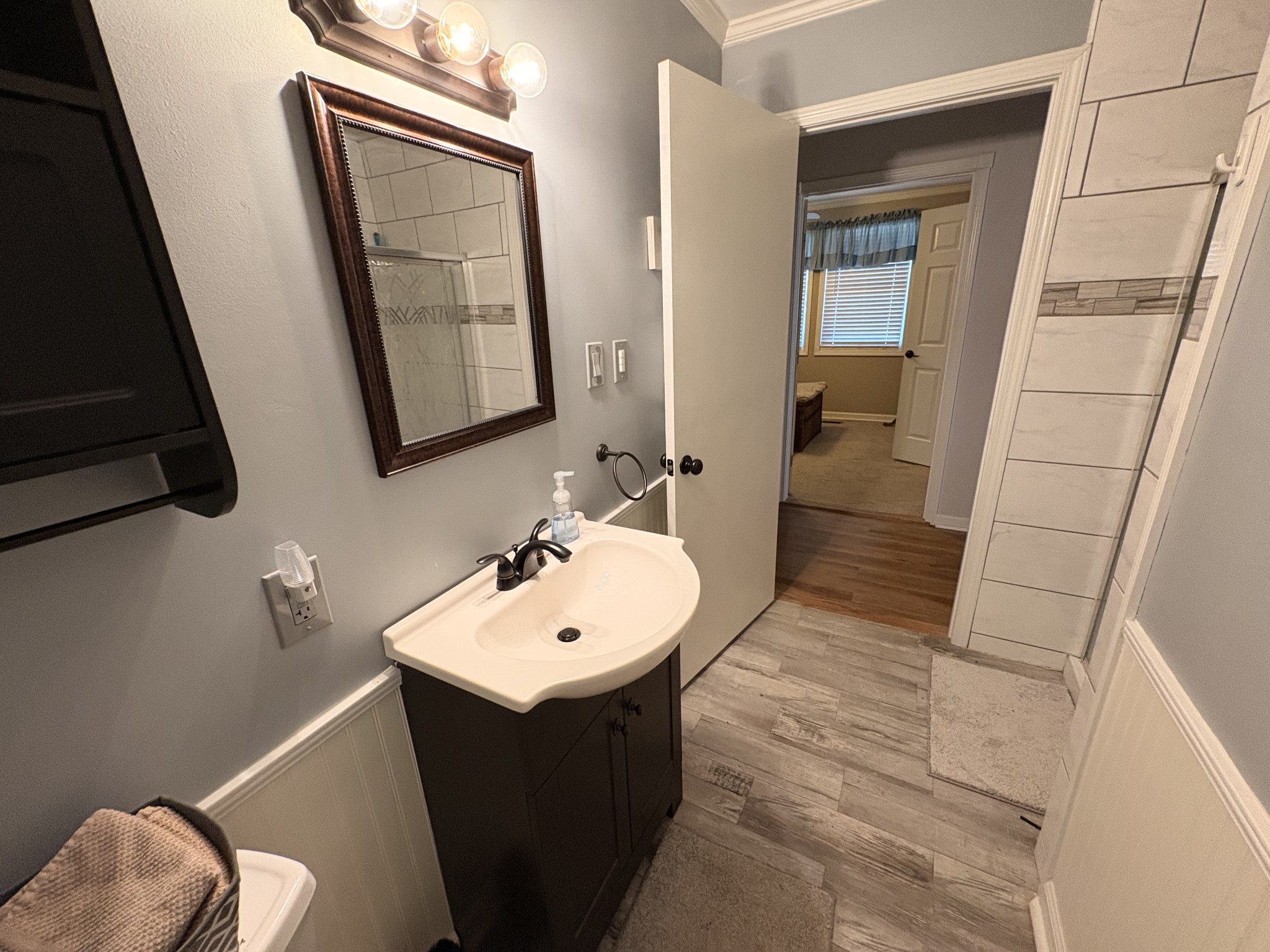 4454 Nancy Green Ridge Road Pulaski, TN 38478 - Photo 24 of 40 a bathroom with a sink vanity and mirror
