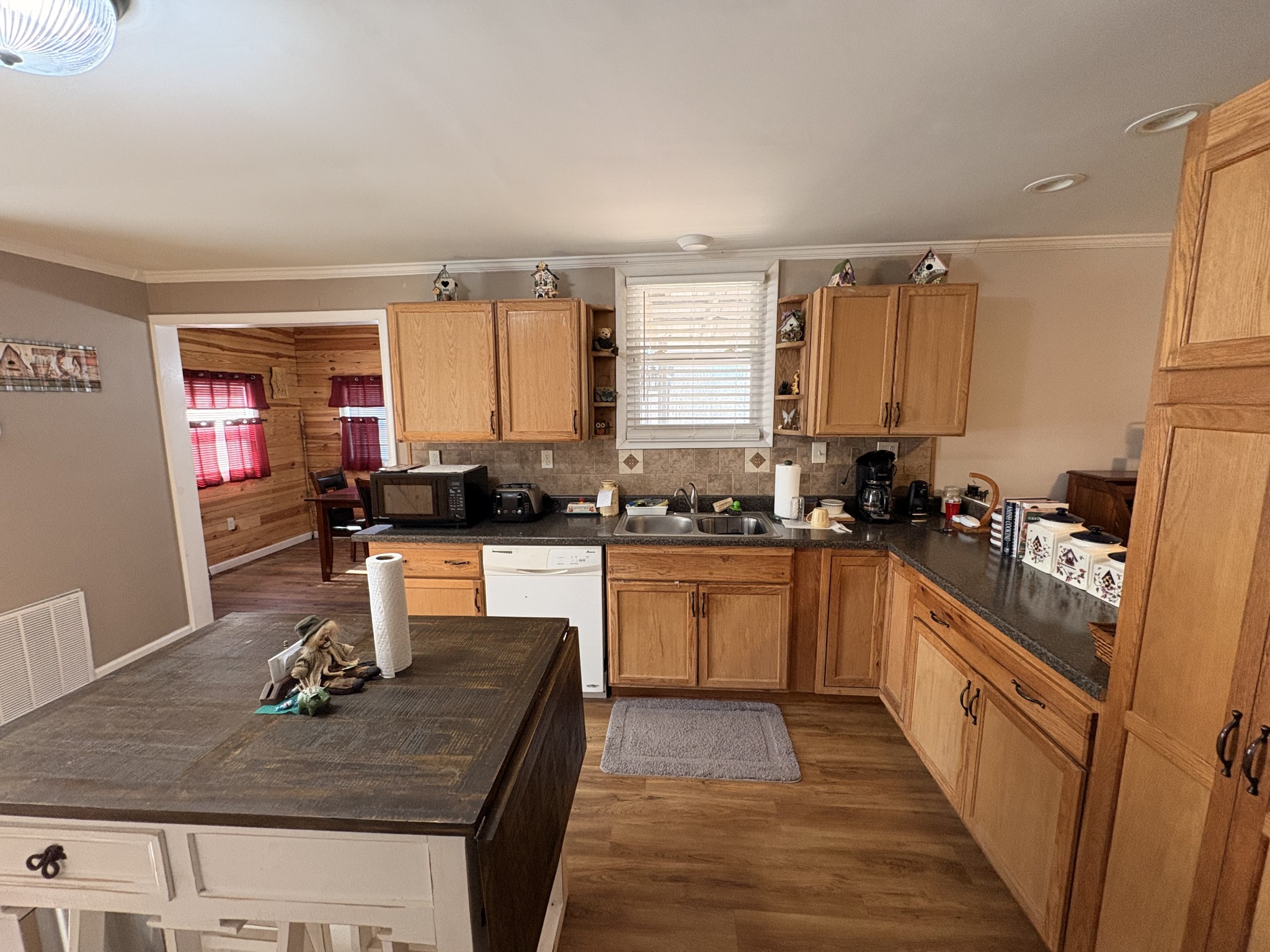 4454 Nancy Green Ridge Road Pulaski, TN 38478 - Photo 5 of 40 a kitchen with a stove a sink a refrigerator and cabinets