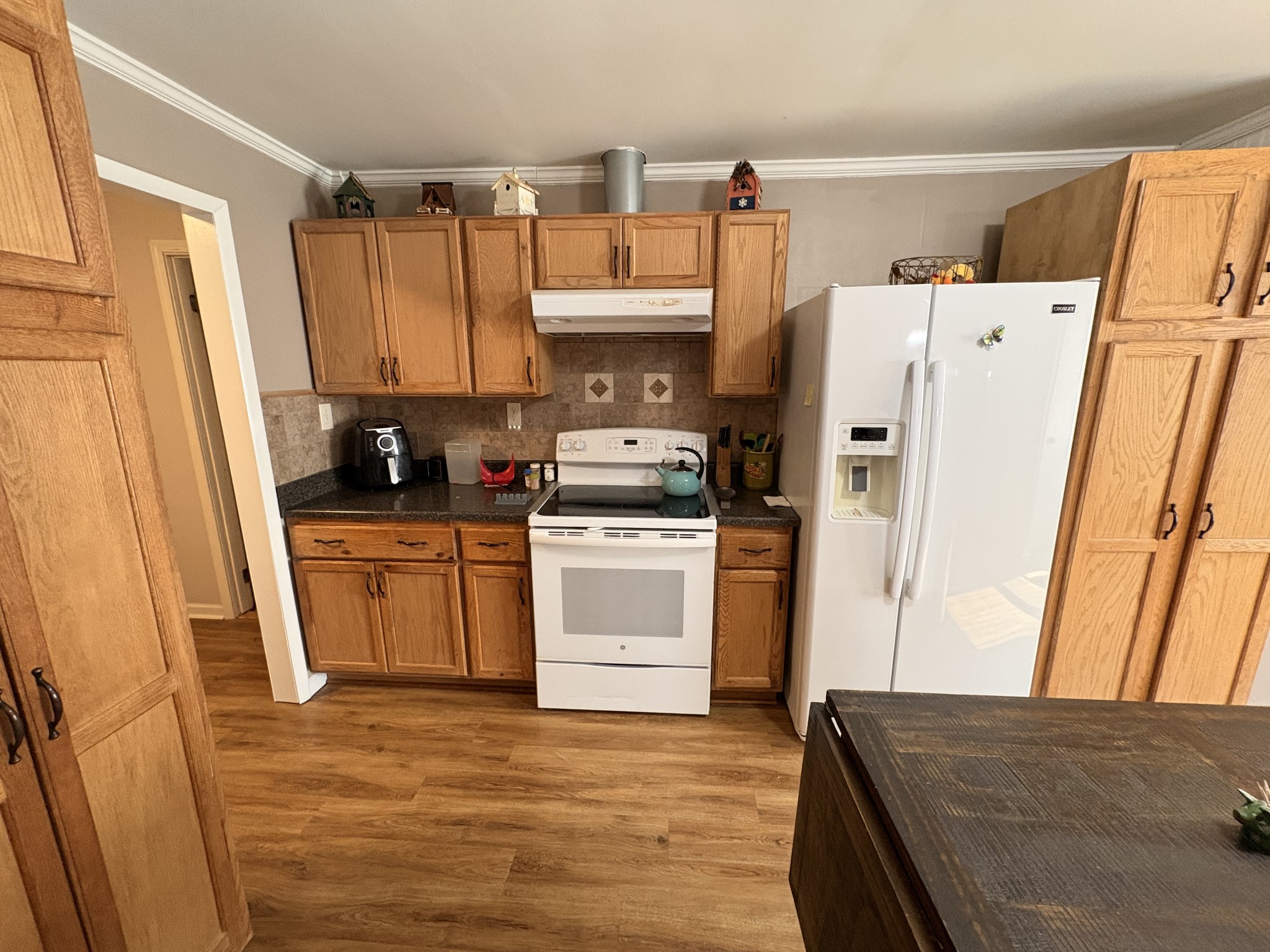 4454 Nancy Green Ridge Road Pulaski, TN 38478 - Photo 8 of 40 a kitchen with a white stove top oven and refrigerator