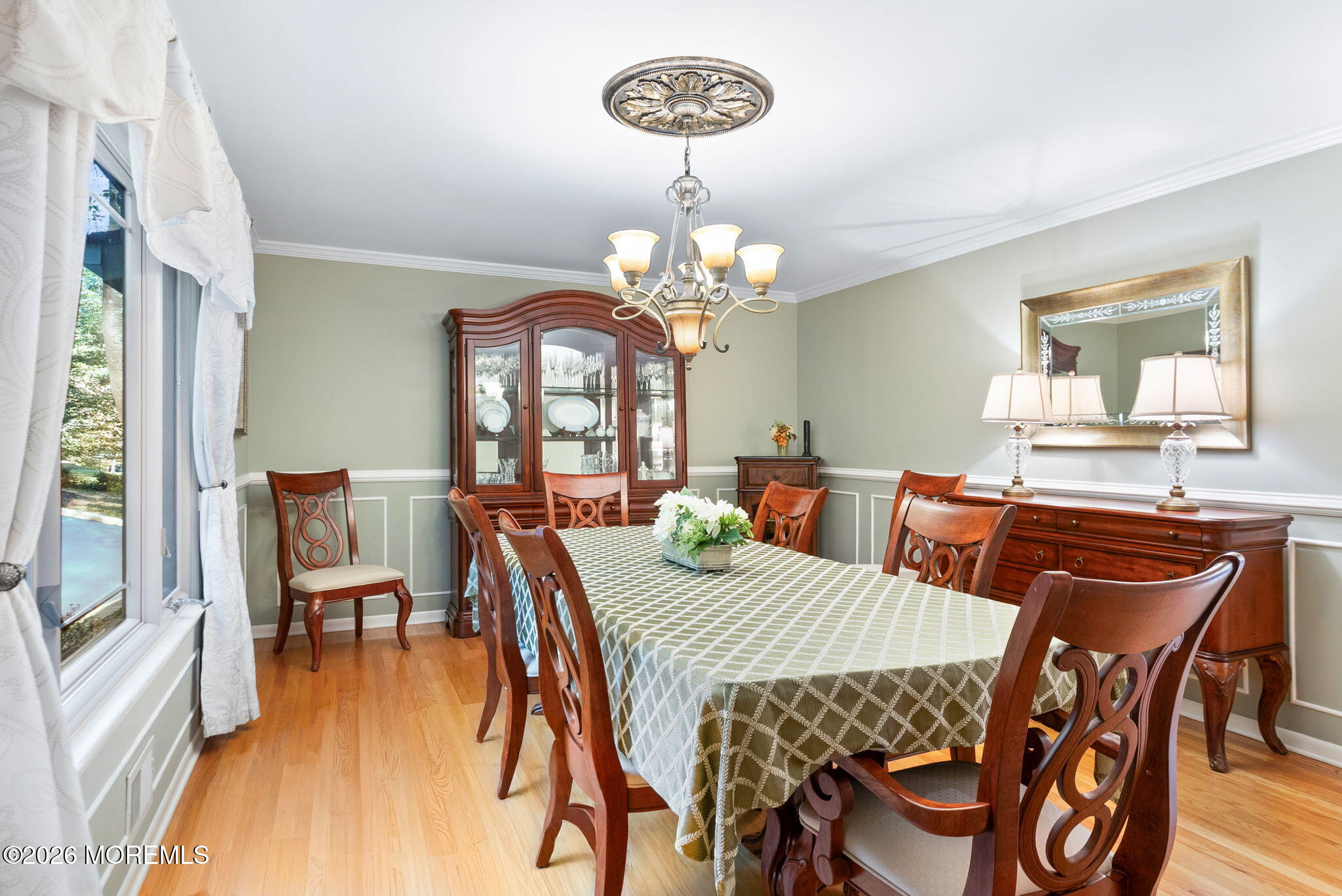21 Stoney Brook Road Holmdel, NJ 07733 - Photo 11 of 40 a view of a dining room with furniture and wooden floor