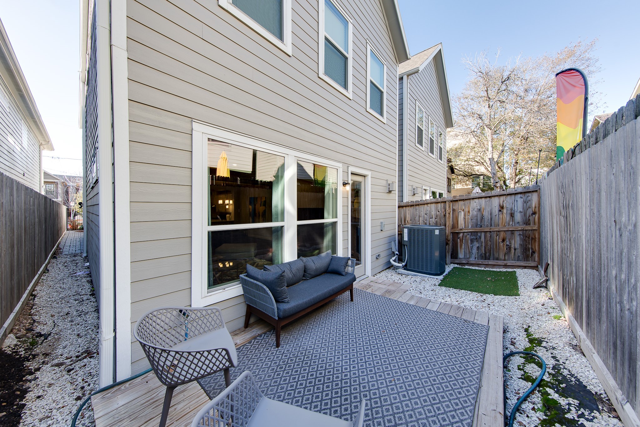 1436 Prince Street, Unit B Houston, TX 77008 - Photo 20 of 20 a backyard of a house with wooden floor and outdoor seating