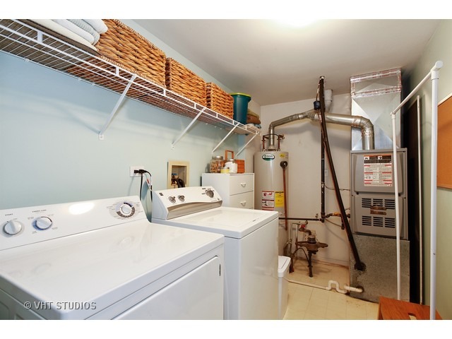 150 Hidden Pond Circle Aurora, IL 60504 - Photo 14 of 15 a utility room with dryer and washer