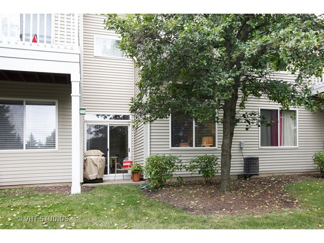 150 Hidden Pond Circle Aurora, IL 60504 - Photo 15 of 15 a view of a house with backyard