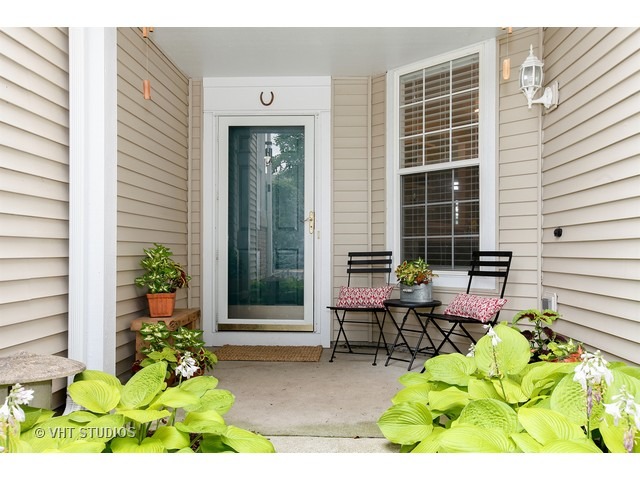150 Hidden Pond Circle Aurora, IL 60504 - Photo 2 of 15 a view of backyard with outdoor seating and plants