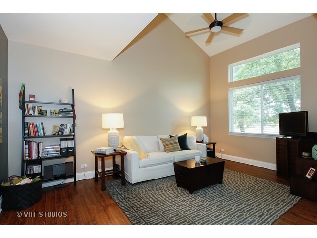 150 Hidden Pond Circle Aurora, IL 60504 - Photo 3 of 15 a living room with furniture and a window