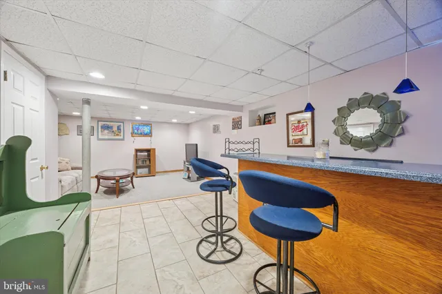 a living room with furniture and next to a window