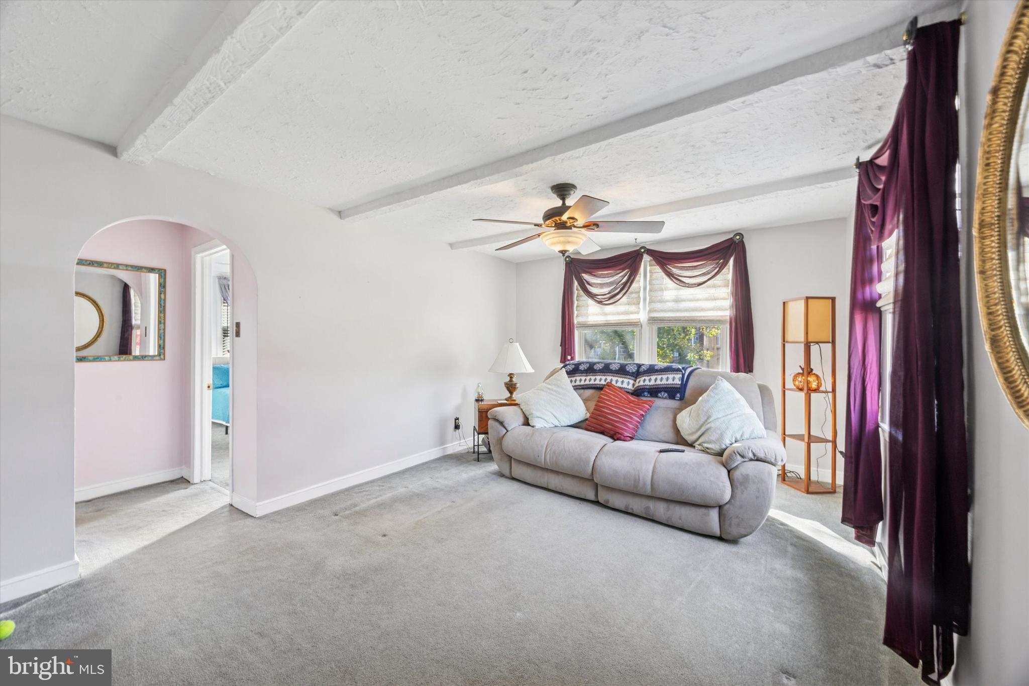 4410 School Lane Drexel Hill, PA 19026 - Photo 3 of 27 a living room with furniture and a fireplace