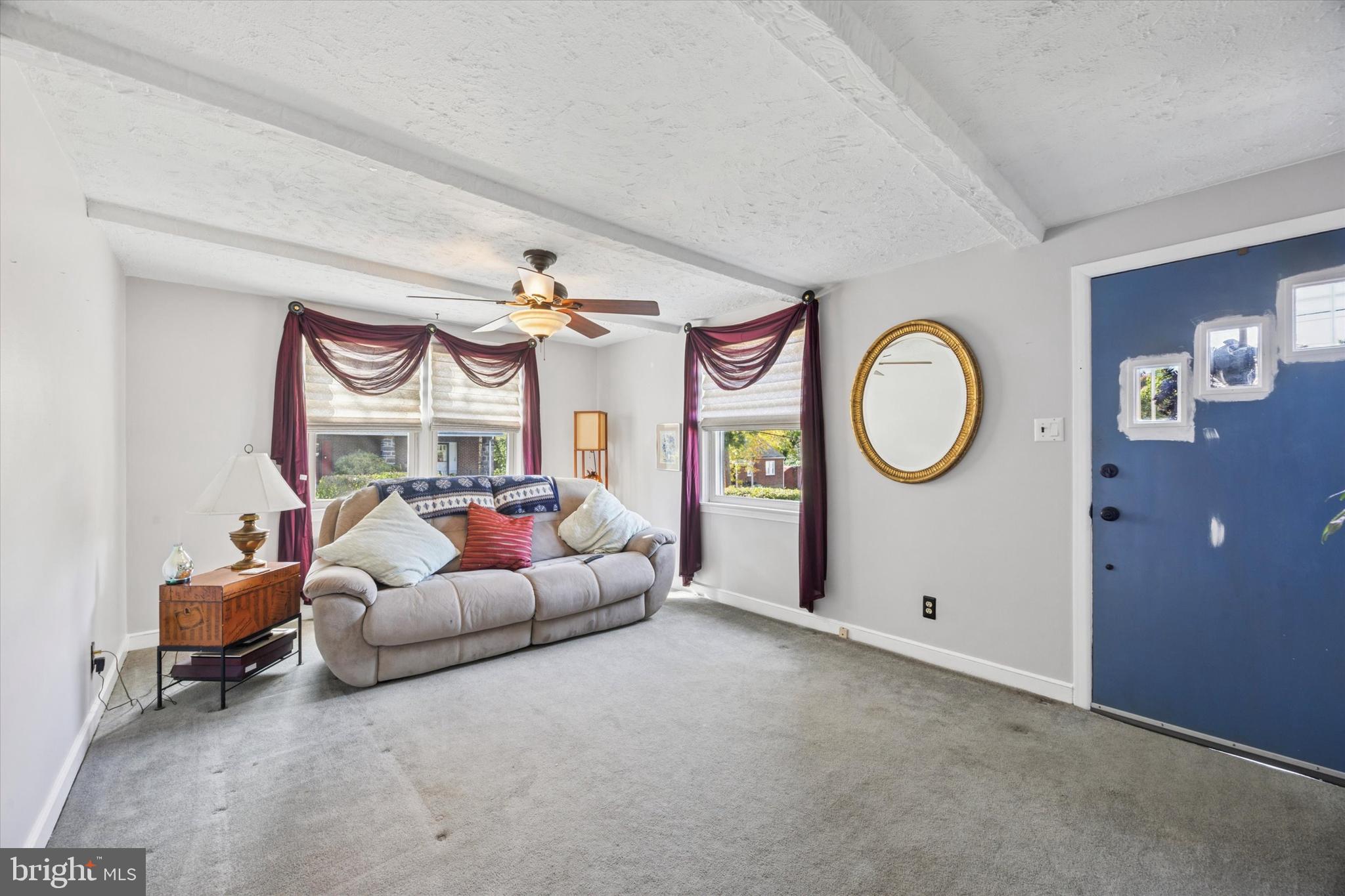 4410 School Lane Drexel Hill, PA 19026 - Photo 4 of 27 a living room with furniture and a mirror