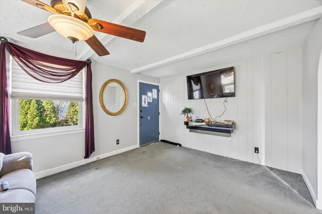 a view of a livingroom with furniture and a flat screen tv