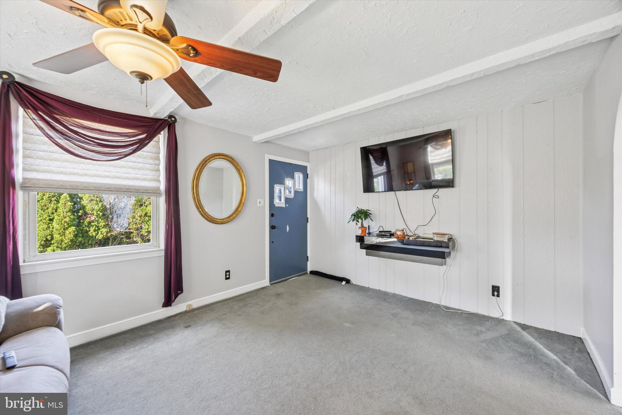 4410 School Lane Drexel Hill, PA 19026 - Photo 5 of 27 a view of a livingroom with furniture and a flat screen tv