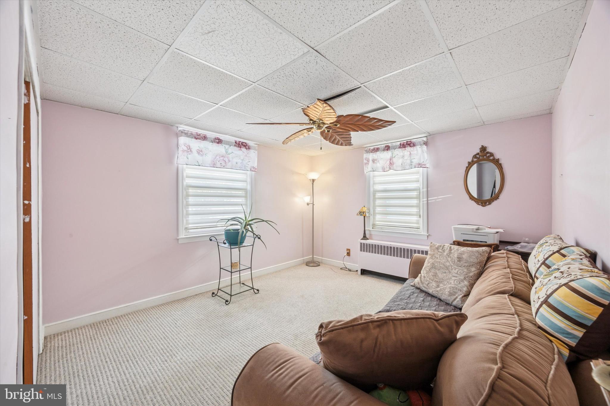 4410 School Lane Drexel Hill, PA 19026 - Photo 9 of 27 a bedroom with furniture and a window