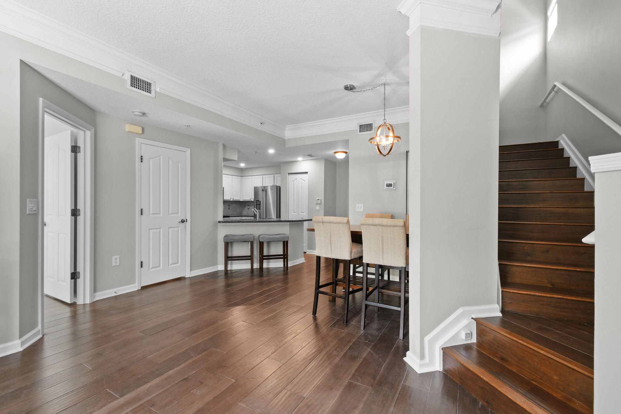 175 Galicia Way, Unit 211 Jupiter, FL 33458 - Photo 11 of 49 a view of dining room with furniture and wooden floor