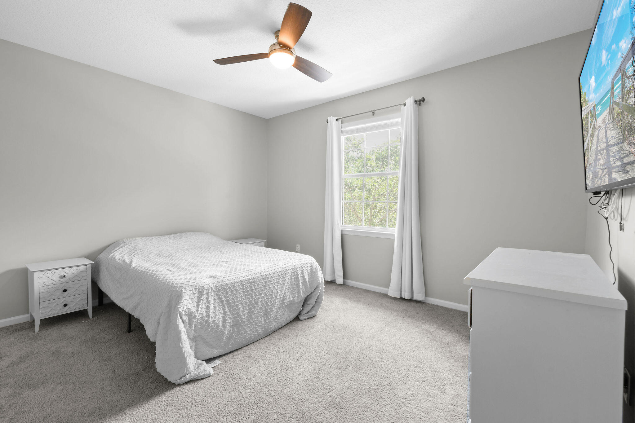 175 Galicia Way, Unit 211 Jupiter, FL 33458 - Photo 20 of 49 a spacious bedroom with a bed and a window