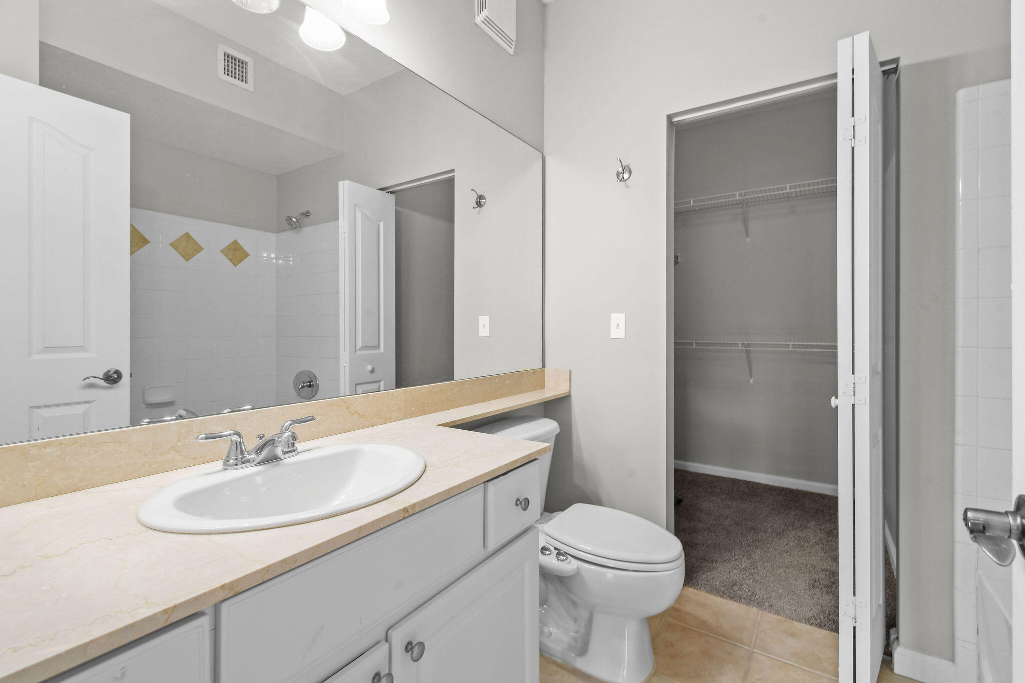 175 Galicia Way, Unit 211 Jupiter, FL 33458 - Photo 28 of 49 a bathroom with a sink toilet and shower