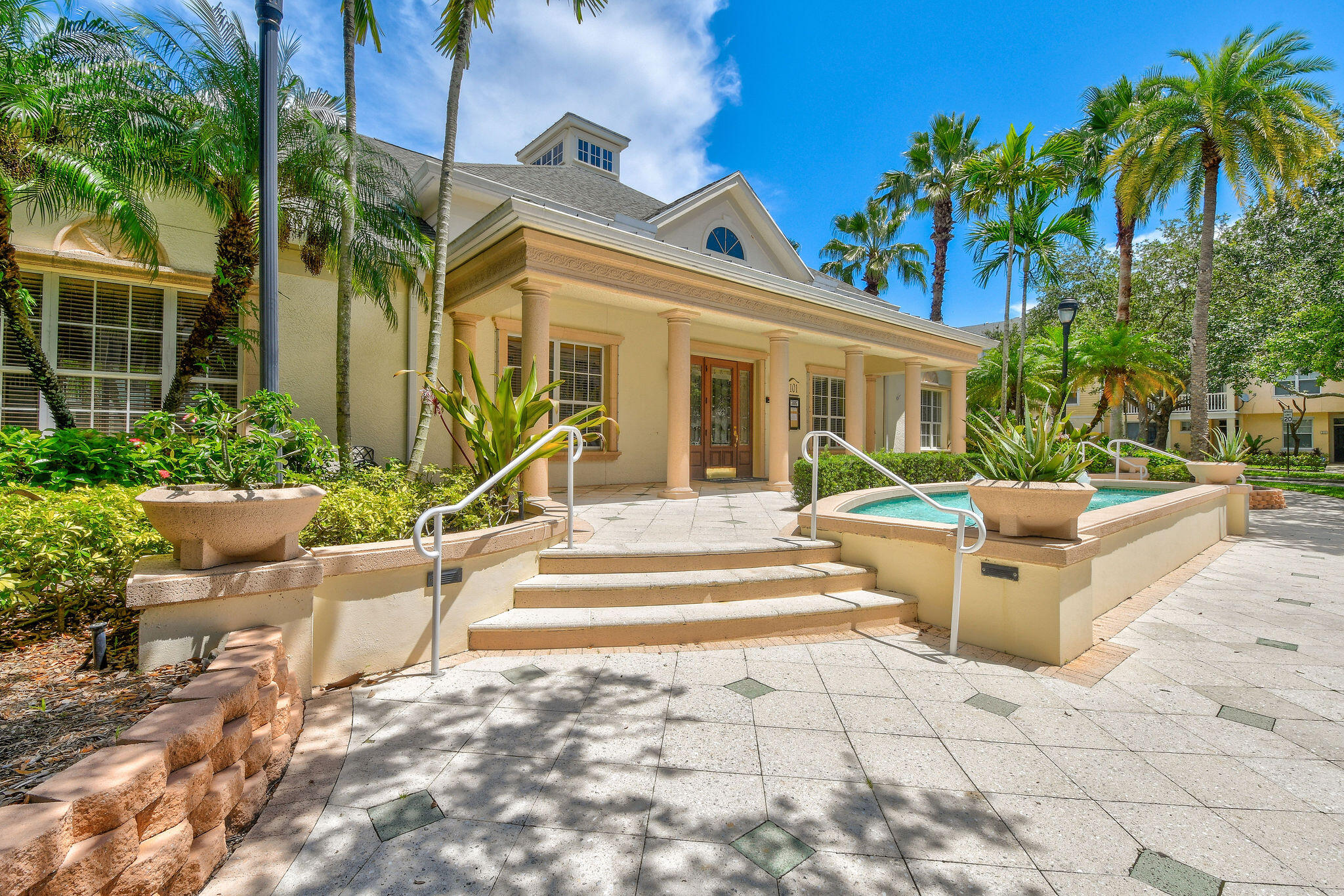 175 Galicia Way, Unit 211 Jupiter, FL 33458 - Photo 33 of 49 a view of a house with backyard and sitting area
